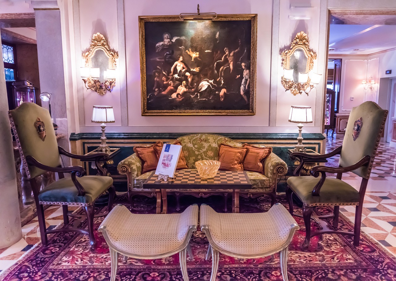 A cozy and elegant luxury hotel lobby with a grand fireplace.
