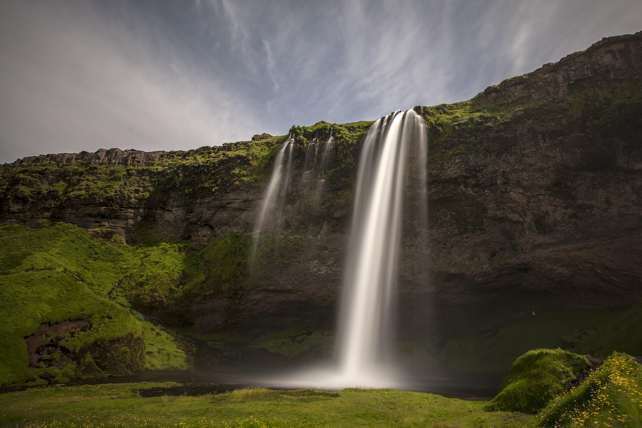 The majestic Dynjandi waterfall cascading down green cliffs in the Westfjords