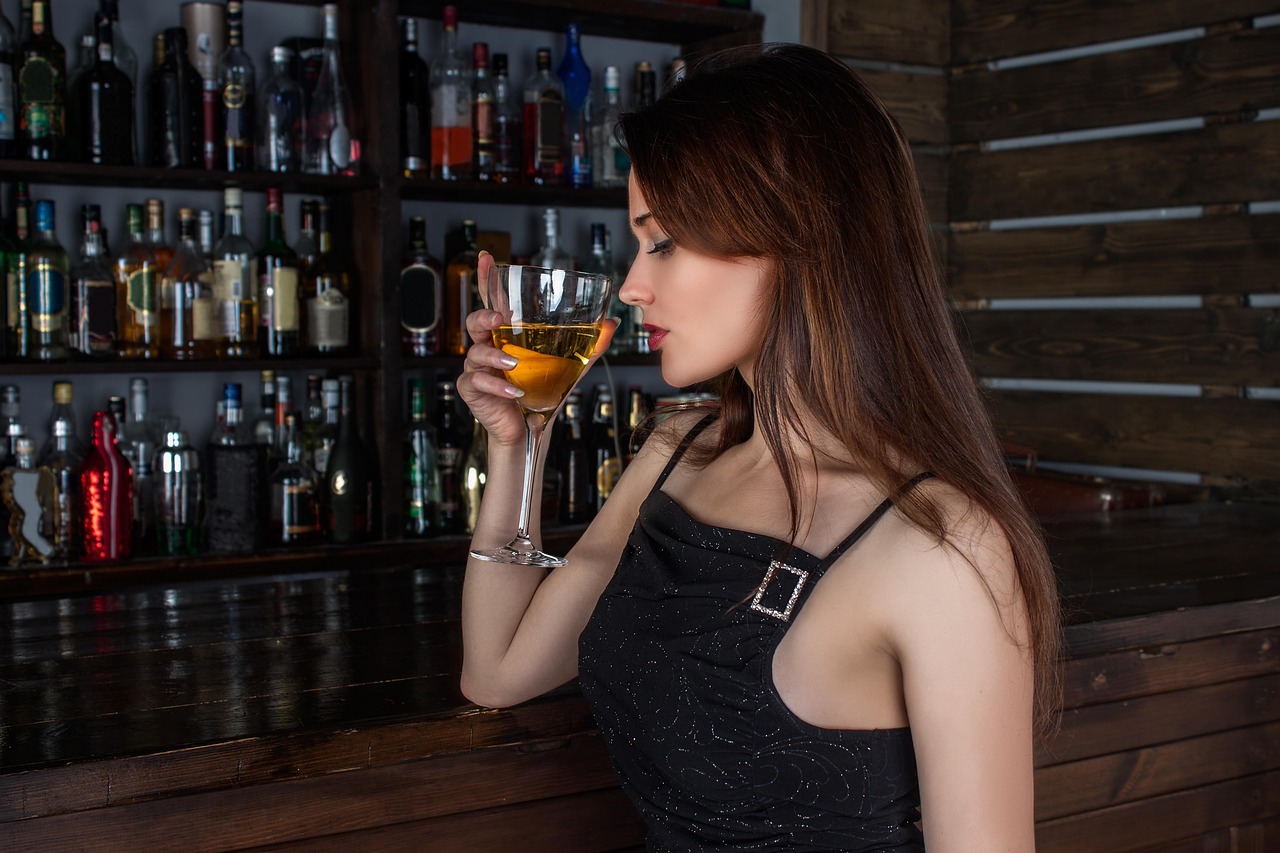 A sophisticated cocktail bar with warm lighting and unique glassware.