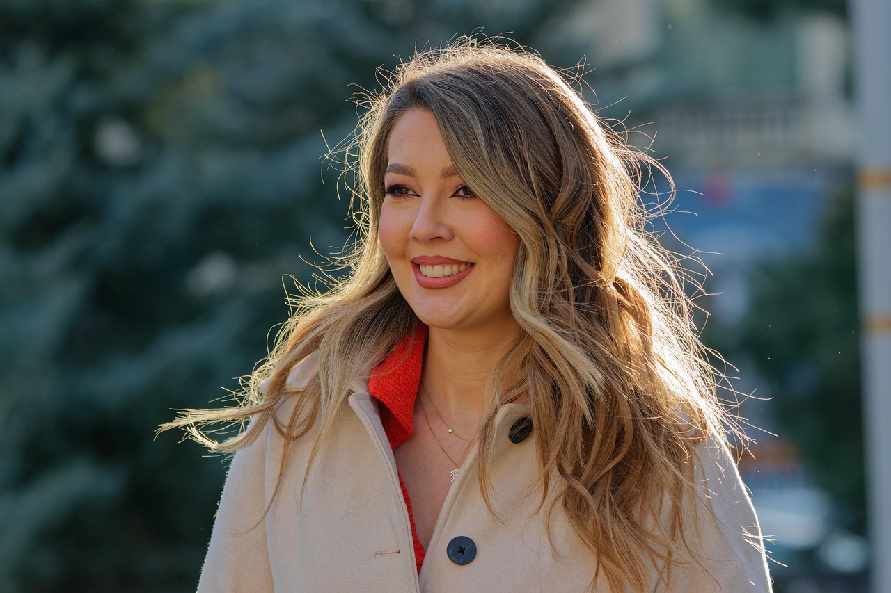 A woman in a modern technical winter jacket walking through a snowy urban city center
