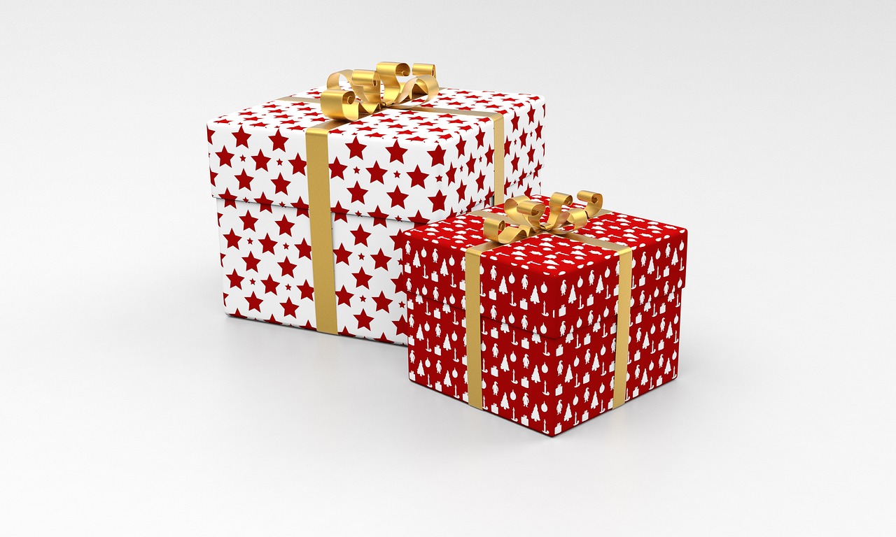Wrapped gift boxes with elegant ribbons against a minimalist background.