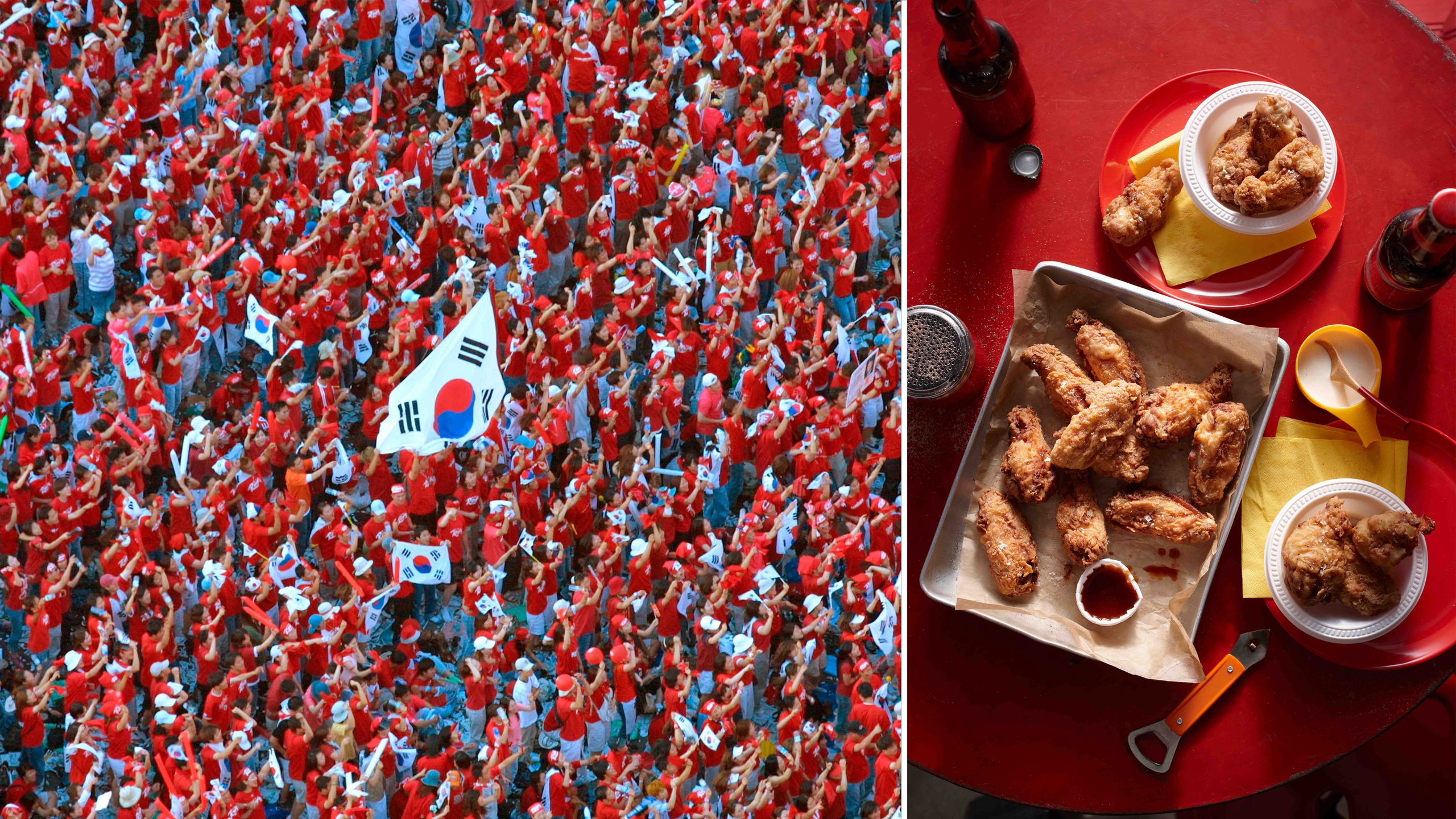 Enthusiastic South Korean soccer fans waving national flags during a game.
