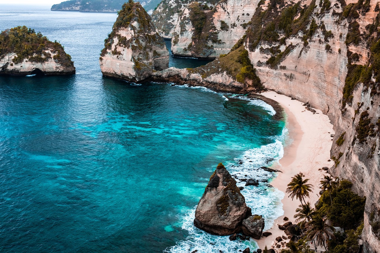 Aerial view of the rugged hills and turquoise bays of Komodo National Park.