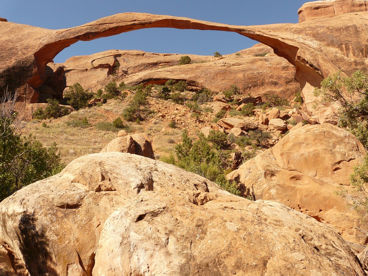 The massive natural sandstone Corona Arch in Moab, Utah.