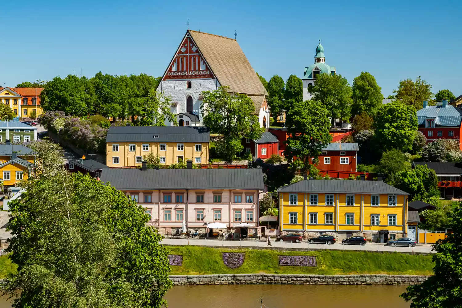 The iconic cathedral and colorful wooden houses of Old Porvoo.
