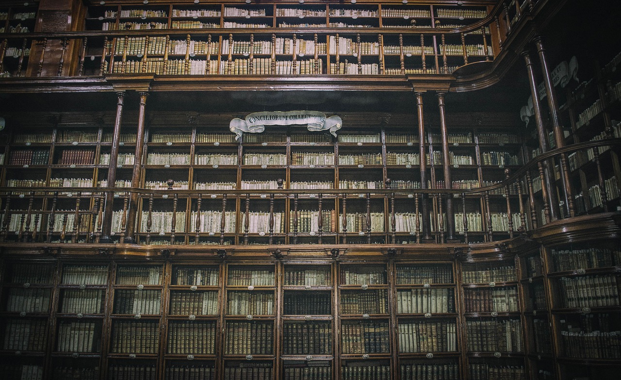 Interior of the Baroque Biblioteca Joanina in Portugal with gold decorations
