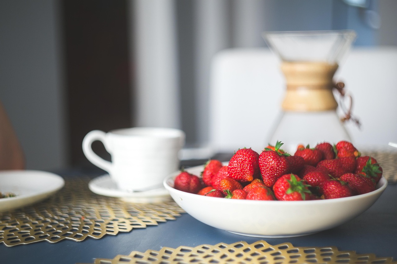An aesthetic breakfast spread with organic fruits, avocado toast, and specialty coffee