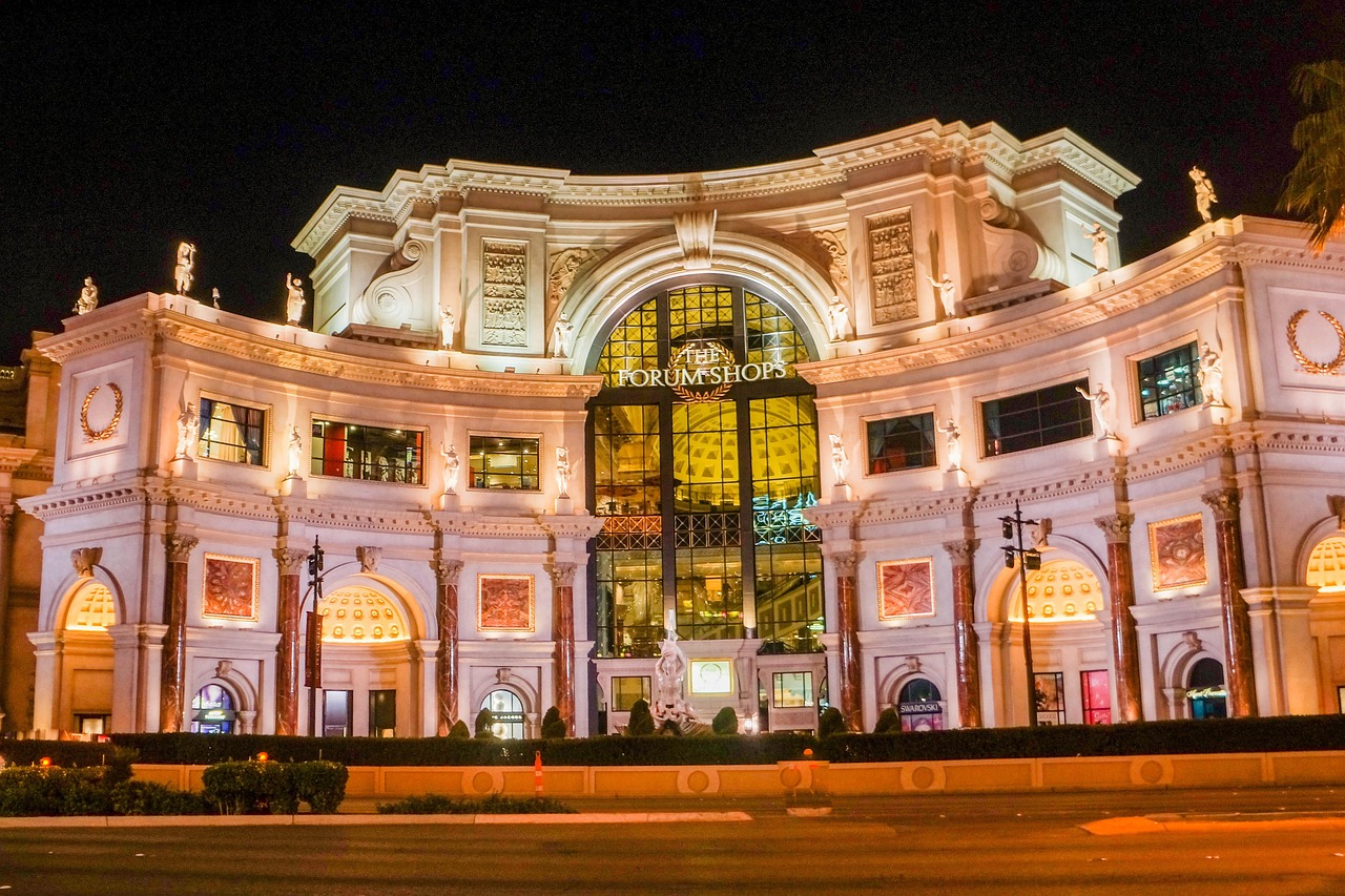 Fireworks illuminating the Roman-style architecture of Caesars Palace on the Las Vegas Strip.