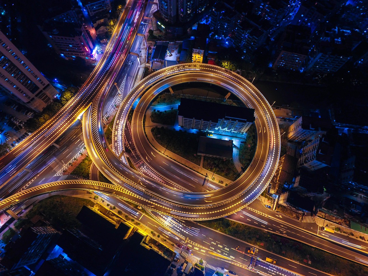 High-altitude night view of Chicago's grid and the Magnificent Mile