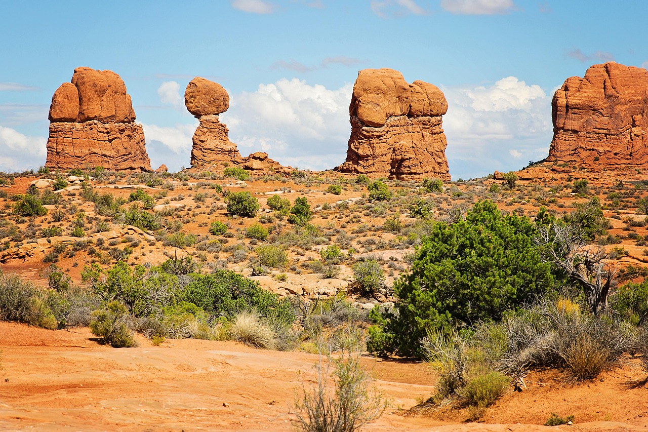 Dramatic red rock formations under a bright blue sky in Moab, Utah