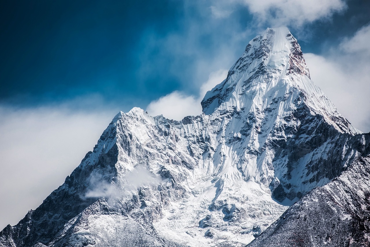 The iconic small stone church in Theth valley surrounded by high mountain peaks