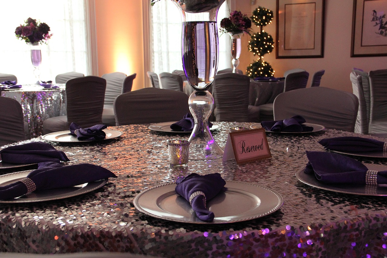 An elegantly set table in a high-end restaurant with crystal glasses.