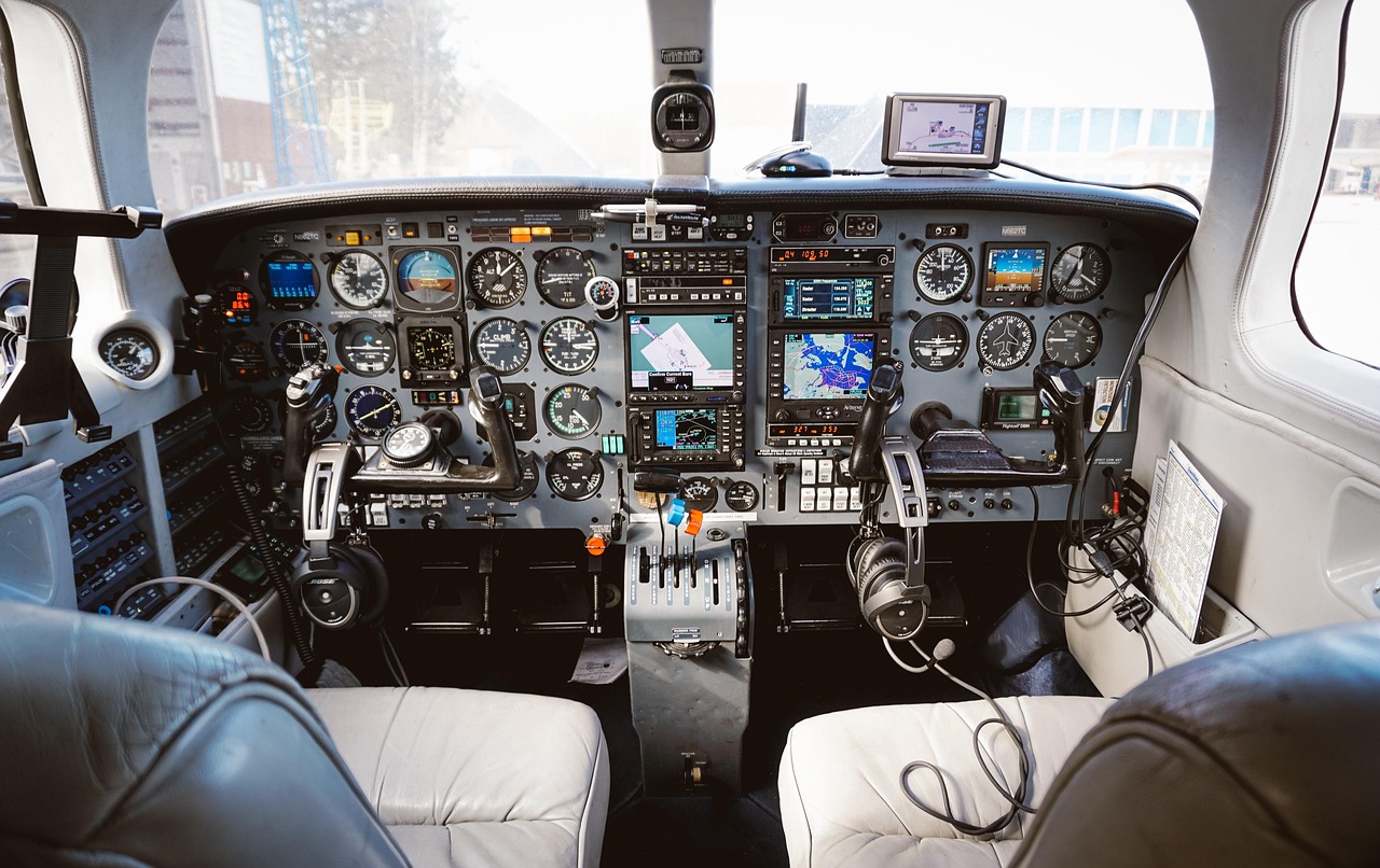 A spacious and modern first-class airplane cabin seat with premium amenities.