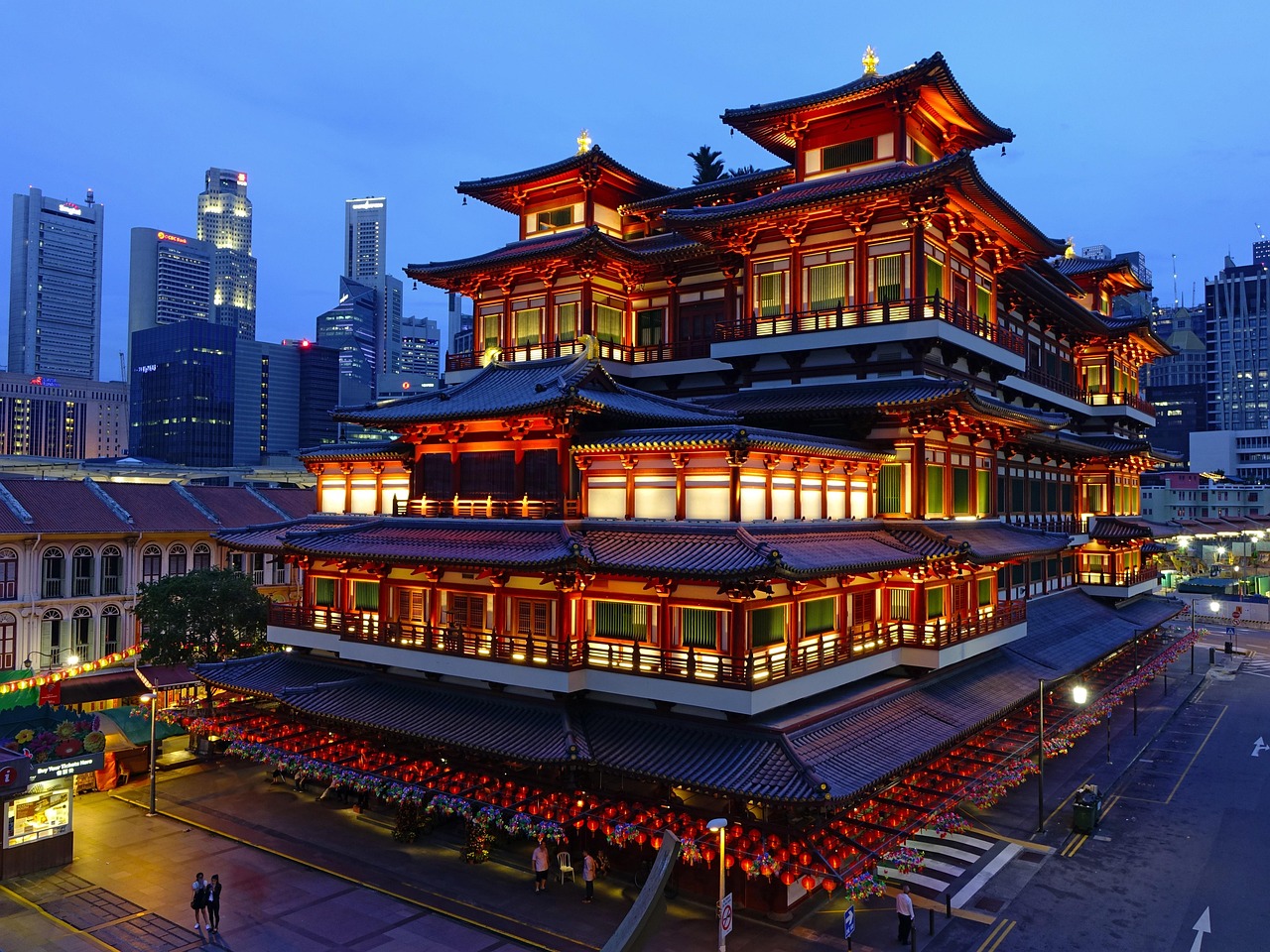 Row of colorful historic shophouses in Singapore Chinatown.