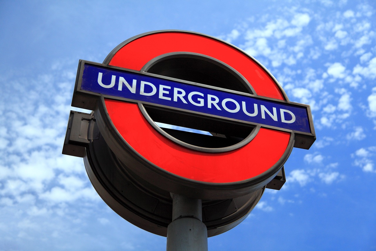 The red and blue London Underground roundel sign at a city station