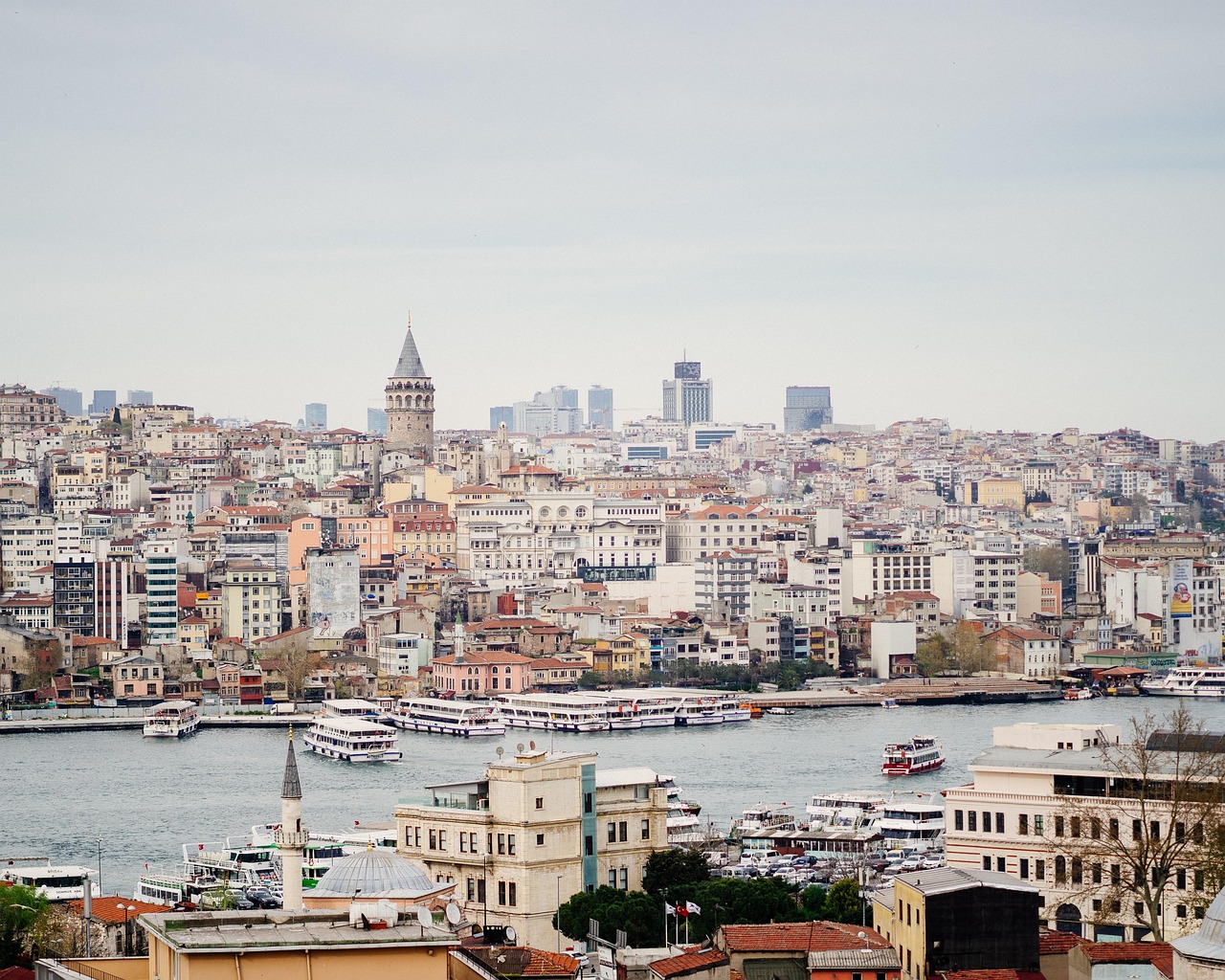 A narrow street leading to the Galata Tower with cafes and boutiques