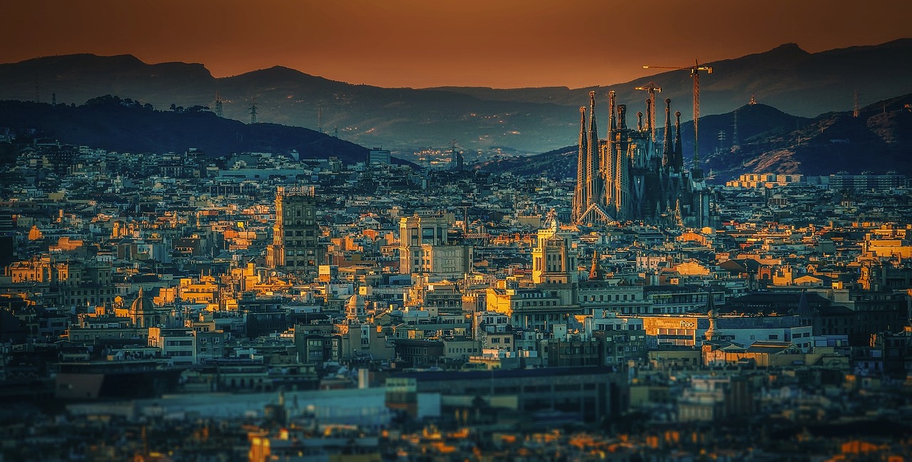 The intricate towers and facade of the Sagrada Familia cathedral in Barcelona.