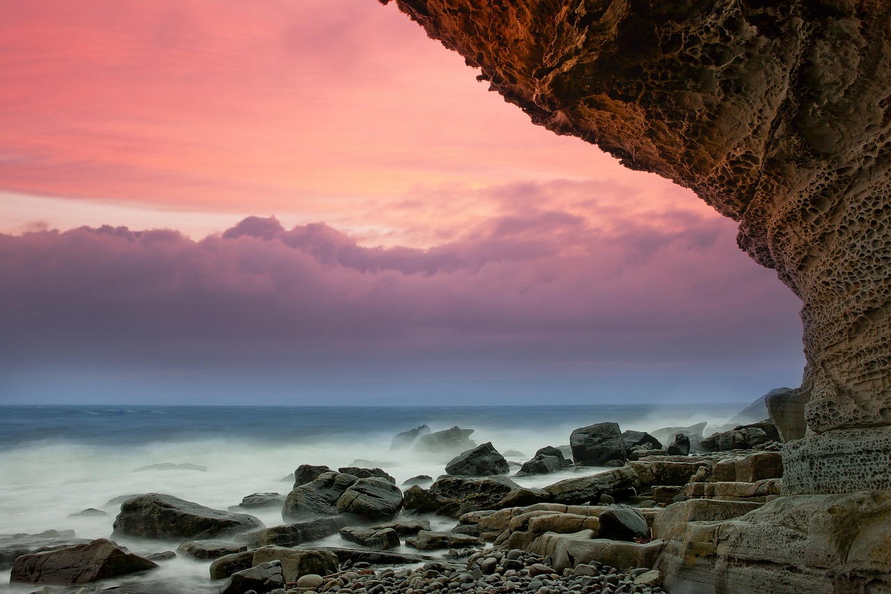 A dramatic rocky coastline with crashing waves at Kleinmond, South Africa.