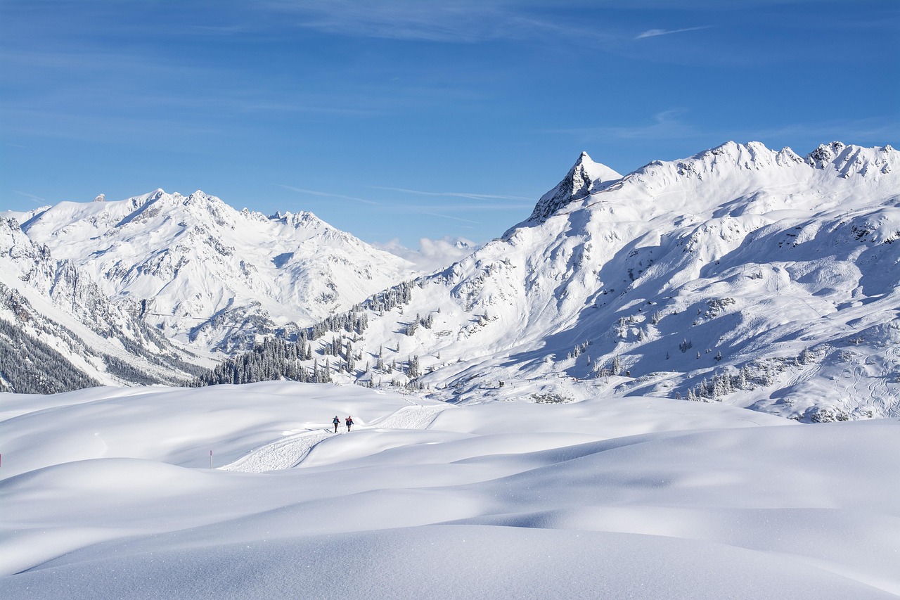 An alpine skier racing down a snowy slope during a competition.