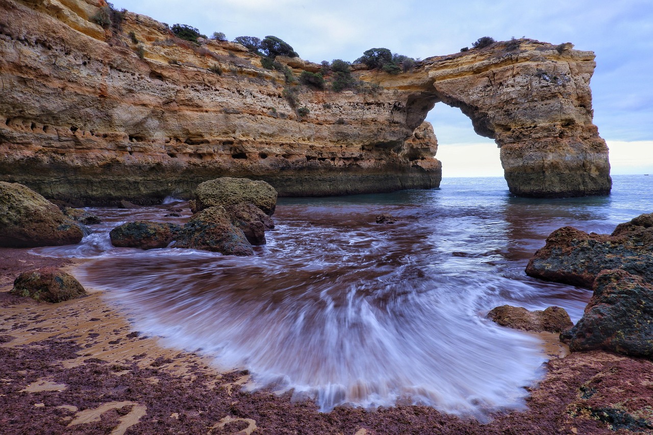 Dramatic rock formations and turquoise water in Algarve Portugal