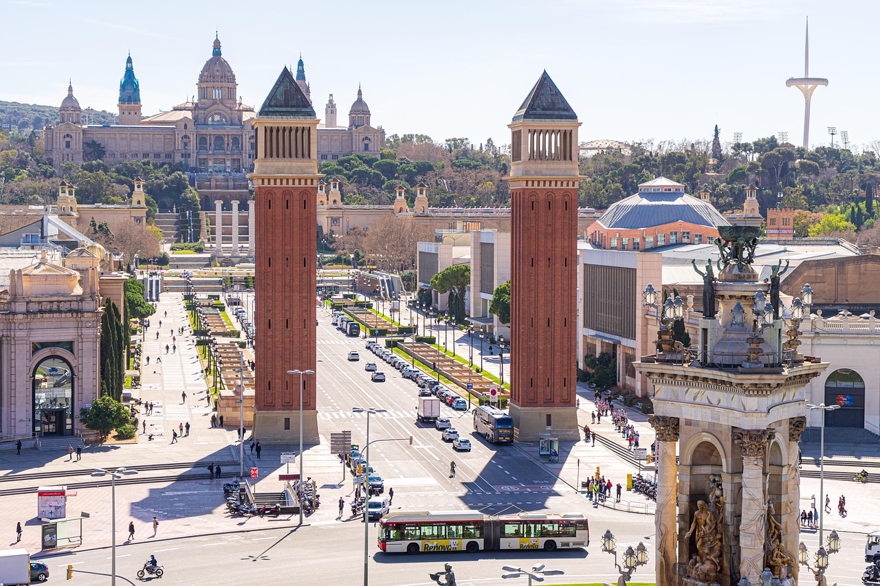Wide, sunlit sidewalks of the Eixample district in Barcelona showing a family walking.