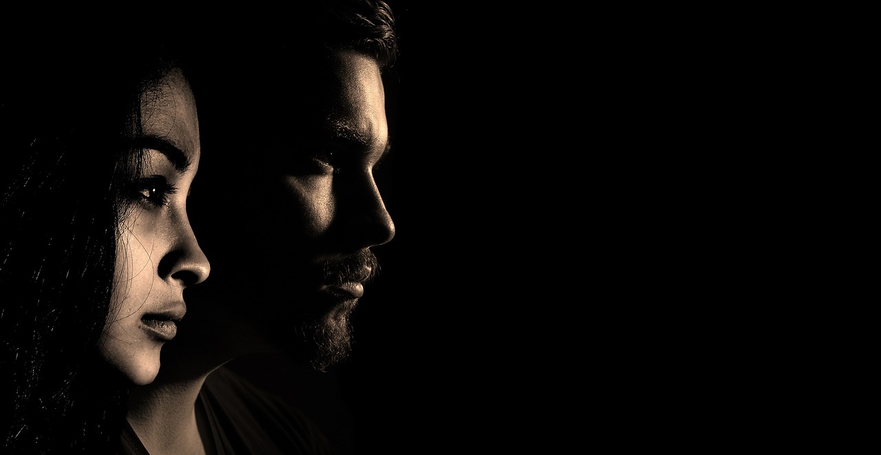 A person applying a cooling treatment to their face to reduce puffiness.