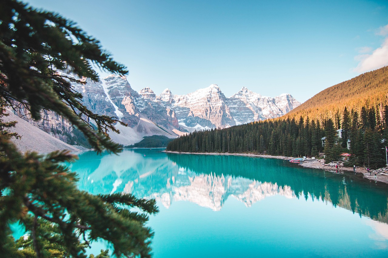 The crystal clear turquoise waters of Emerald Lake beneath jagged cliffs