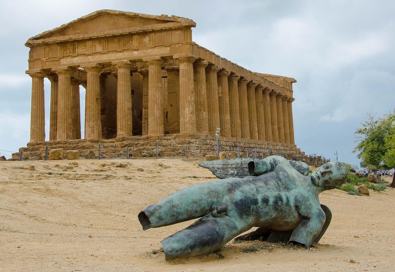 Ancient Greek temple ruins in the Valley of the Temples under a clear blue sky in Sicily.