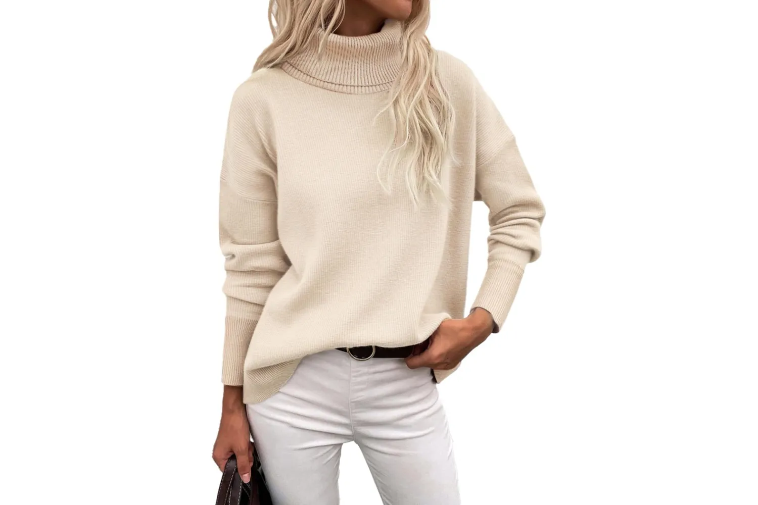 A chunky knitted turtleneck sweater in a neutral cream tone.