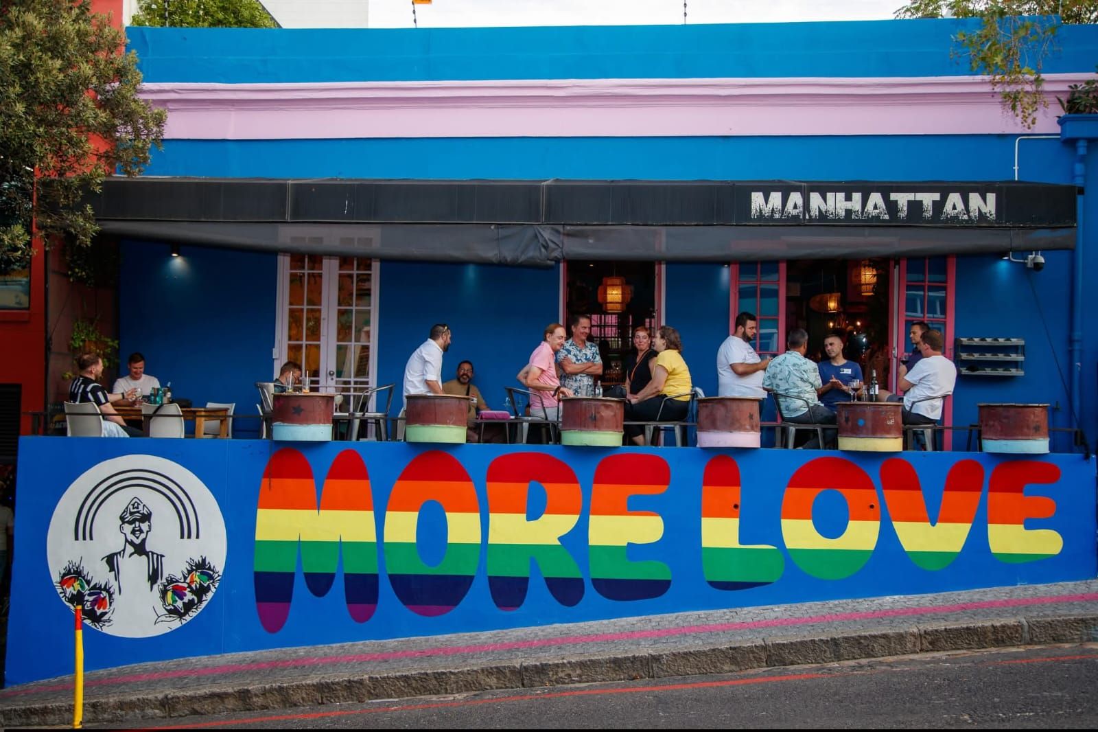 Lively interior of a urban restaurant in Cape Town with people dining.