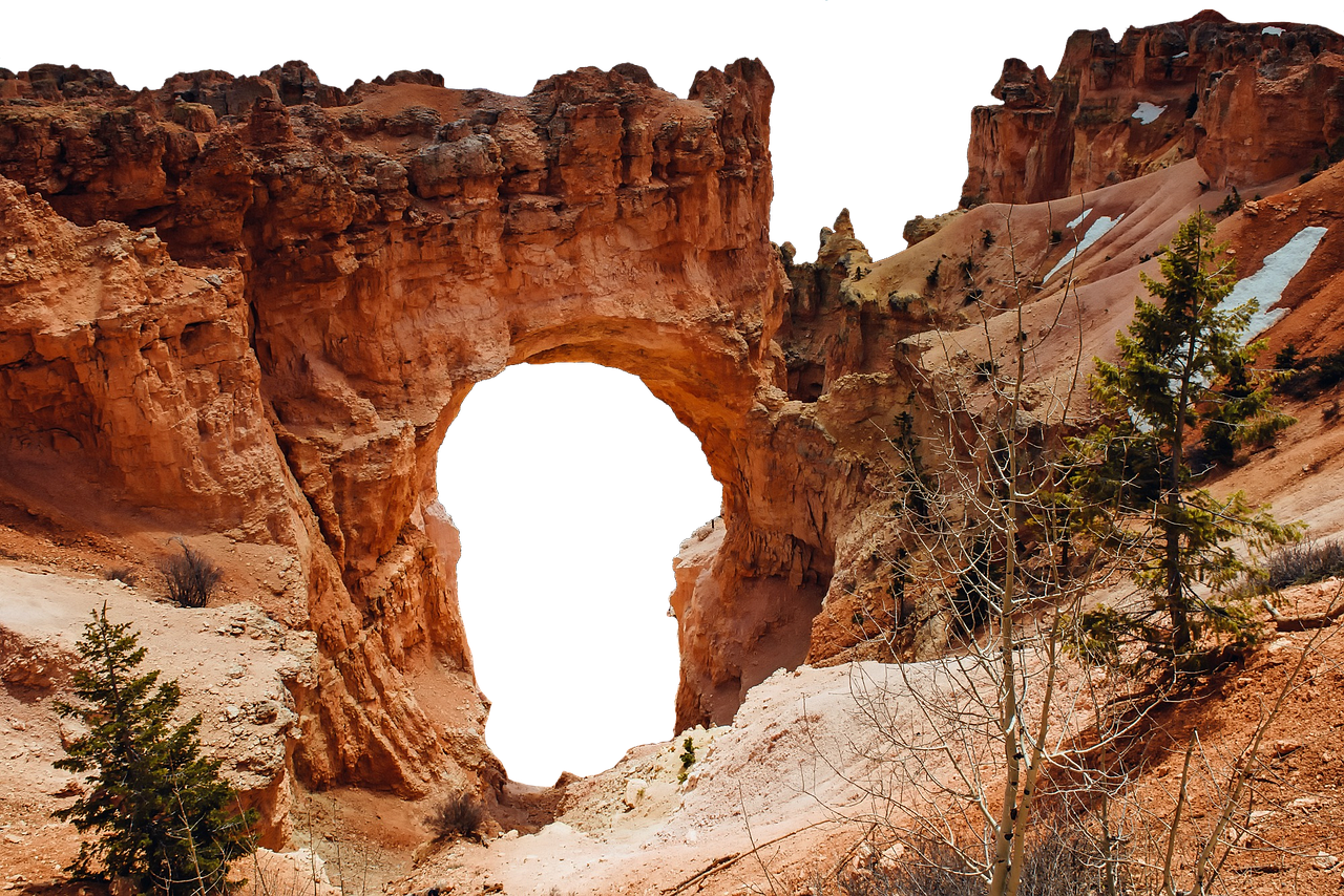 A seasonal waterfall flowing over rocks in the Mossy Cave area of Bryce Canyon.