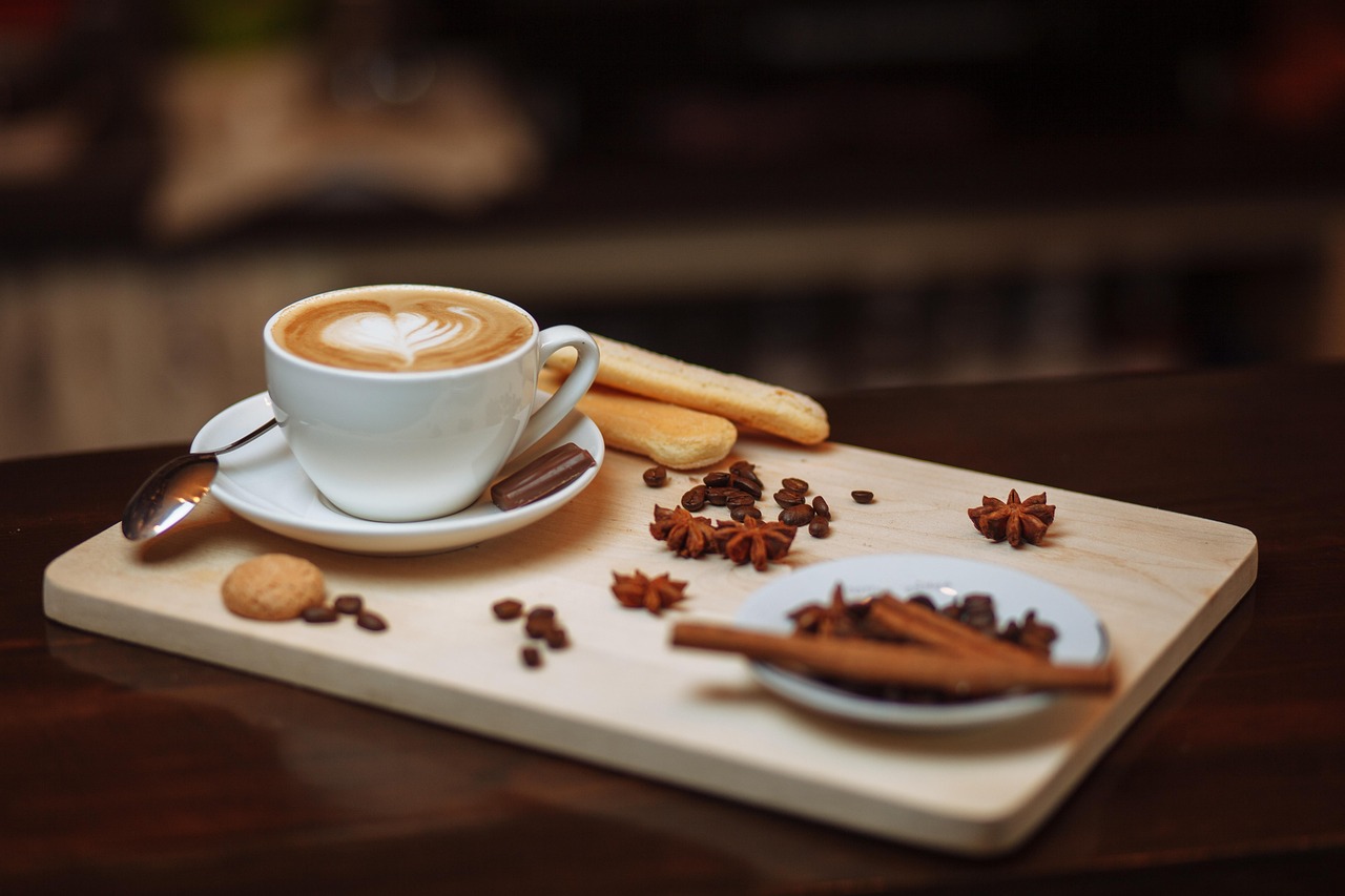 A traditional Roman breakfast with a creamy cappuccino and a maritozzo pastry filled with whipped cream.