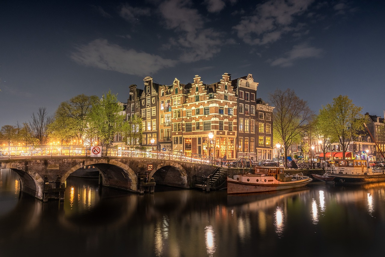 Lights reflecting in the water during an Amsterdam city festival.