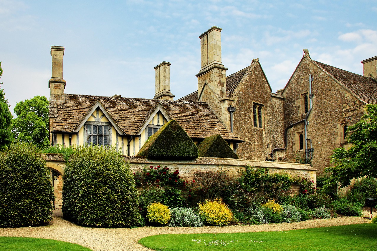 A grand 19th-century estate building with manicured gardens