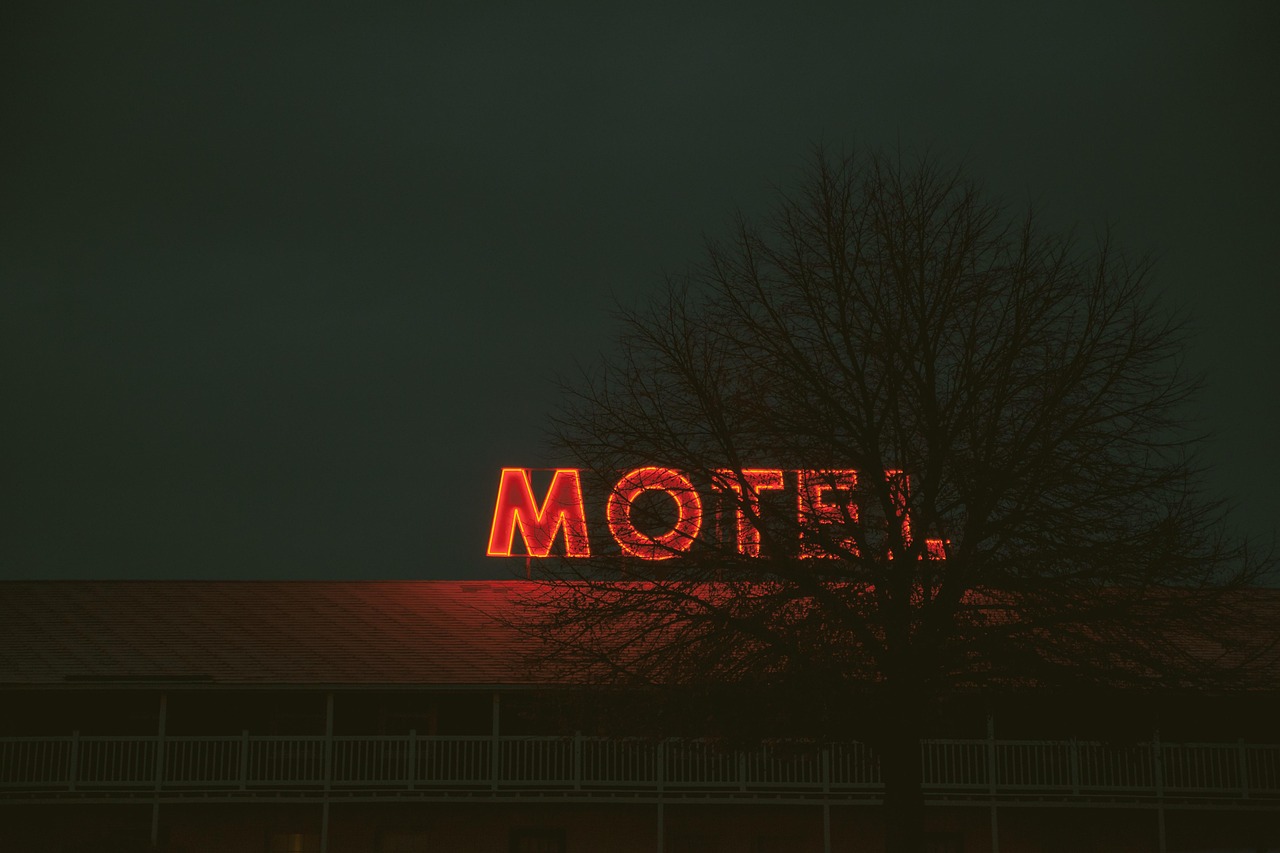 A vintage-style neon sign for a modern, renovated roadside motel.