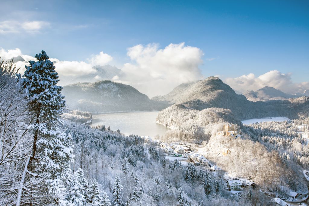 The Ameron Neuschwanstein resort set against the Alpsee lake and Bavarian mountain scenery.