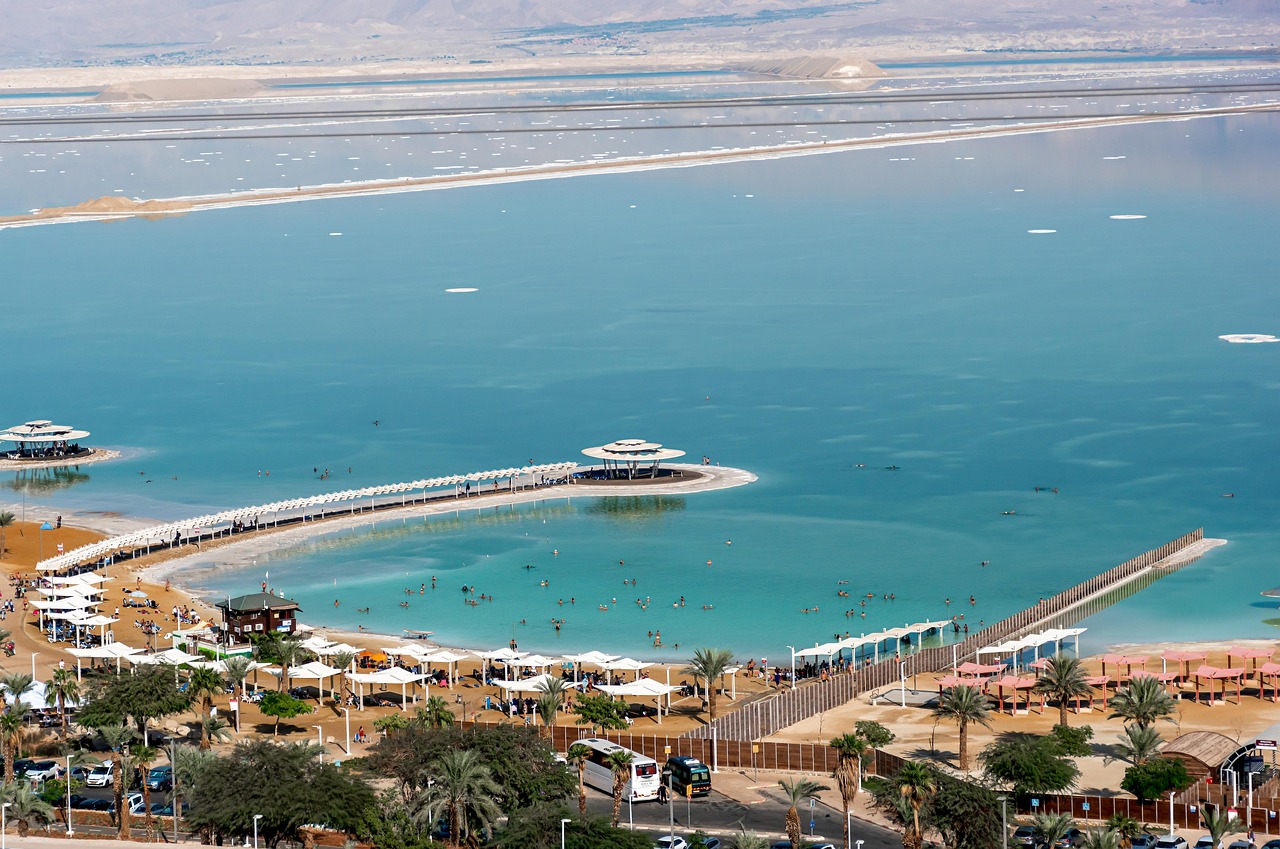 A peaceful resort surrounded by water and desert mountains.