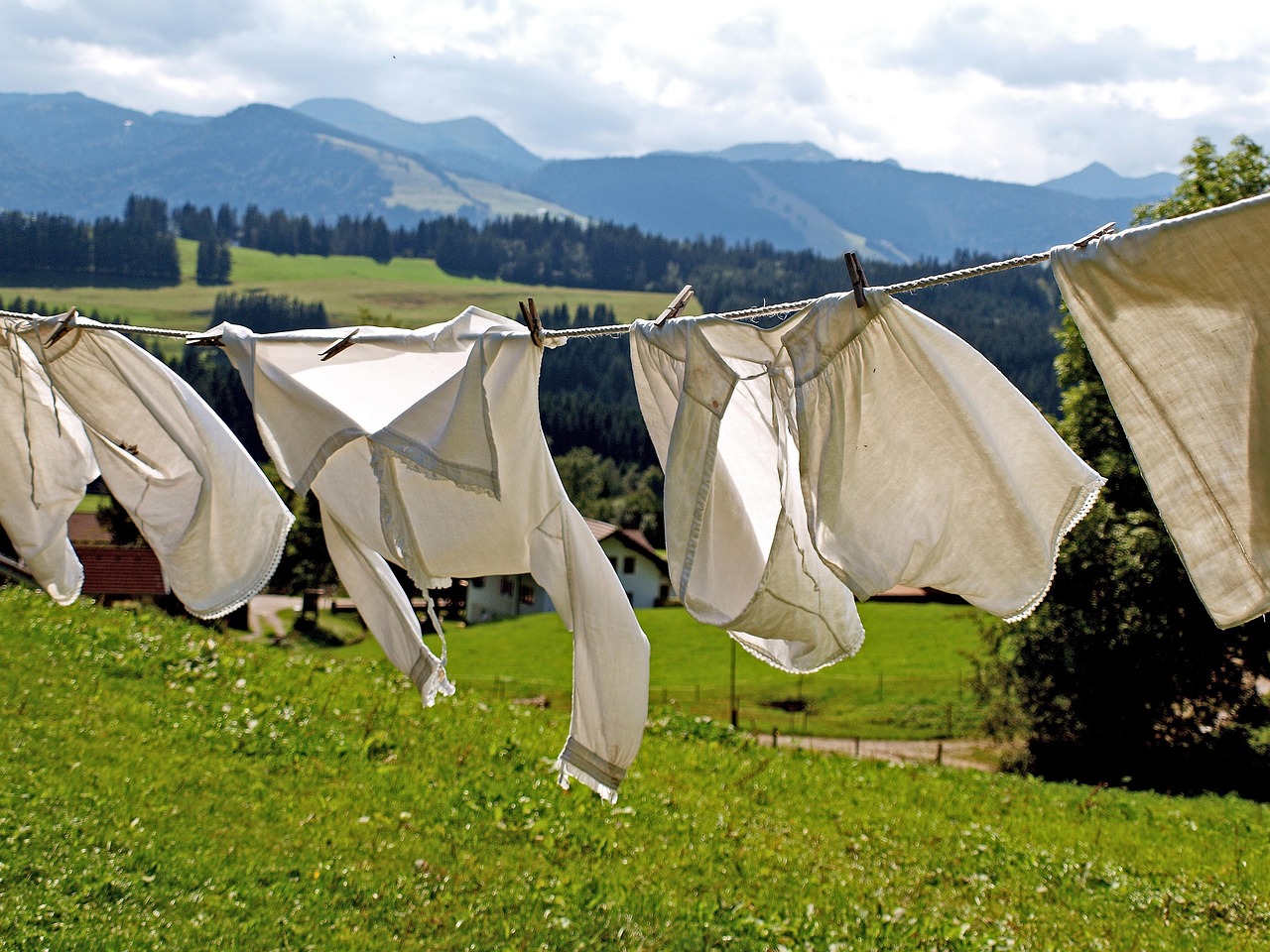 Brightly colored clothes hanging on a line to dry in the warm sunlight.