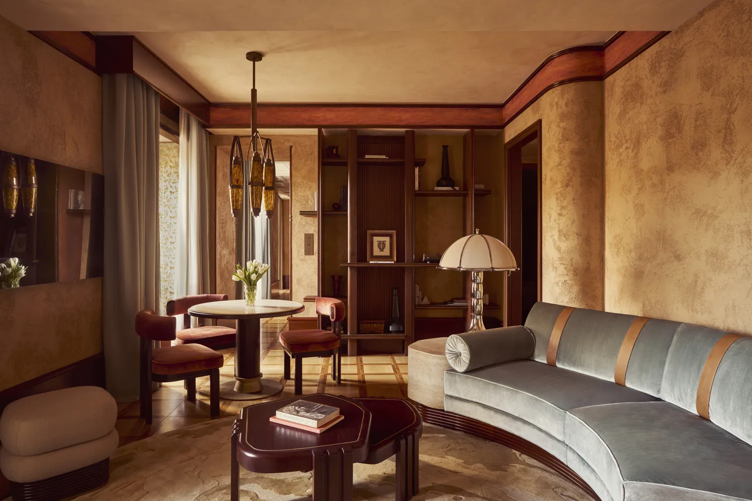 A luxurious suite at Orient Express La Minerva in Rome featuring modern furniture and classical decorative elements.