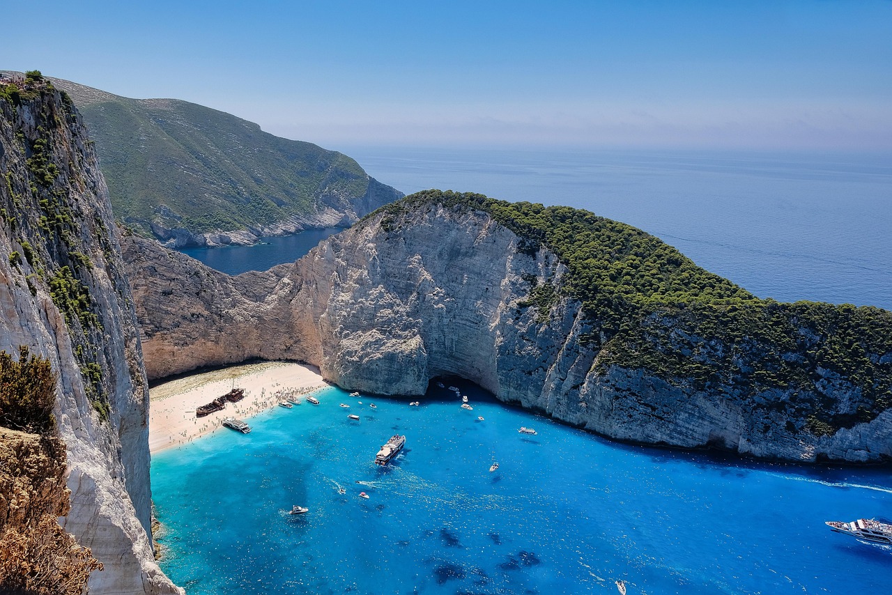 Vibrant turquoise sea hitting rocky cliffs in Mediterranean Turkey