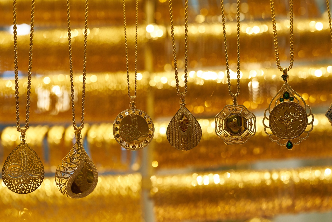 Detailed artisanal gold jewelry displayed in a traditional market.