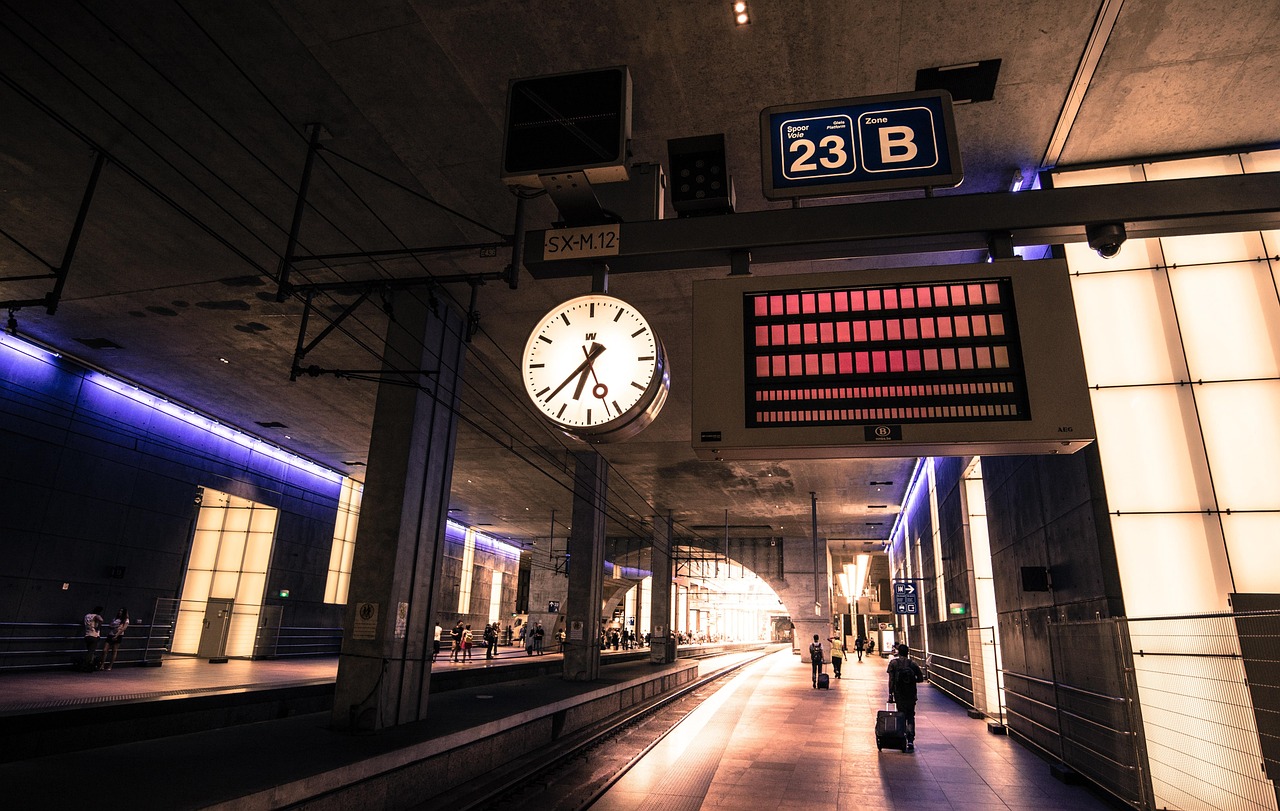 A classic clock hanging at a train station platform