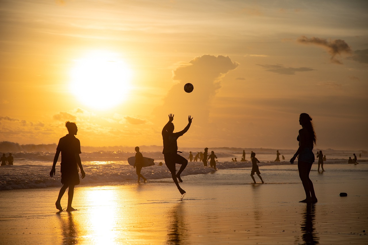 A group of stylish people playing a friendly game of padel under the sun.