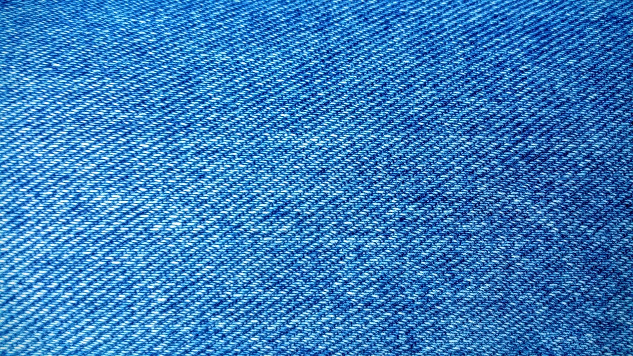 Close-up macro shot of a breathable, high-tech athletic fabric weave.