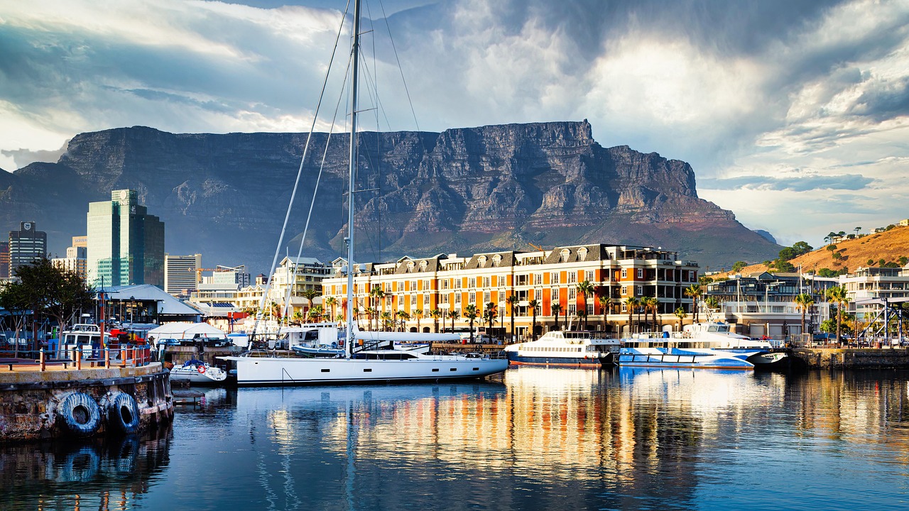 Wide shot of Table Mountain overlooking the city of Cape Town and the ocean.