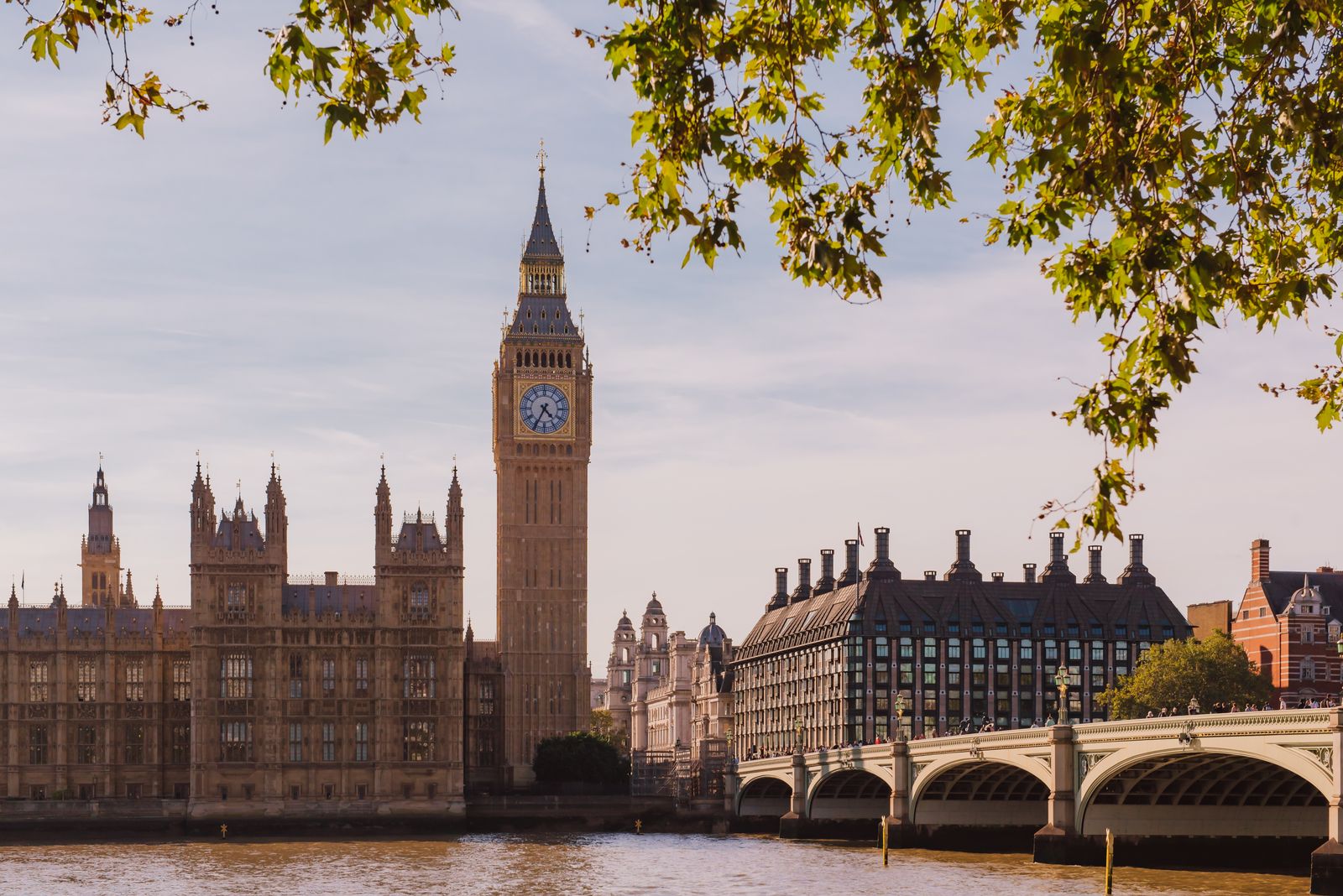 Ornate Baroque palace architecture and a landmark clock tower under a clear sky.