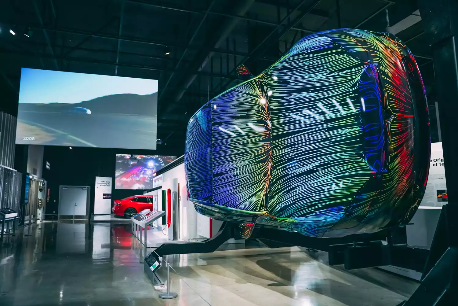 A modern Tesla vehicle on display inside the Petersen Automotive Museum.