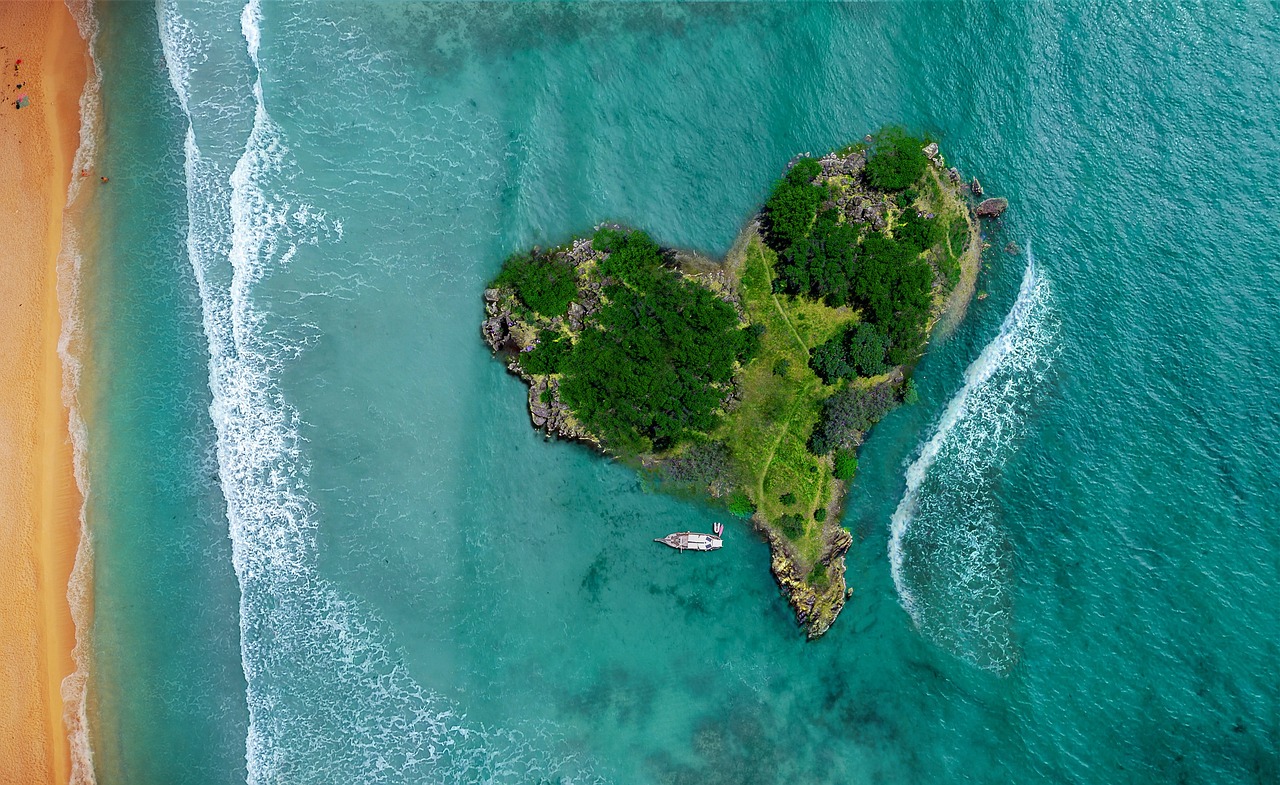 An aerial view of a luxury resort along the white sand coastline of Tulum