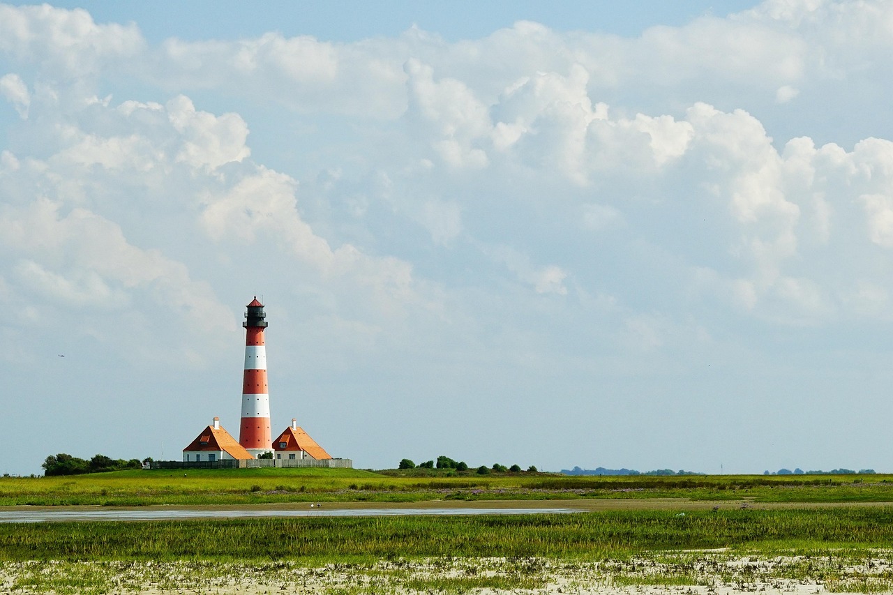A scenic view of the Rincón coastline and lighthouse at sunset.