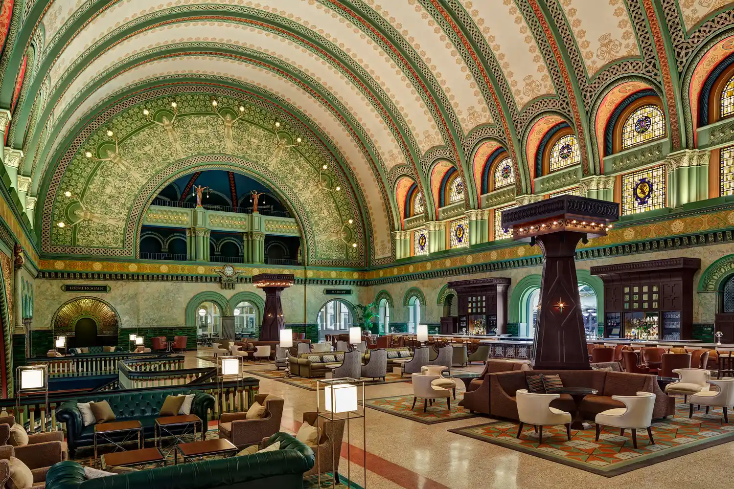 The grand hall of the St. Louis Union Station Hotel with high arched ceilings and lounge area.